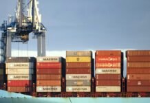 Chinese Port Giant ZPMC Caught in a 38-Company Ransom Threat ZPMC container cranes at a port terminal at dusk — the port machinery maker named on the n0n 38-company ransom leak list